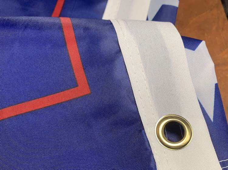 brass grommets and closeup of nylon custom trump flag